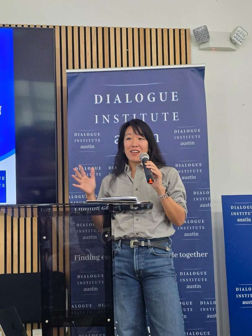Selena Xie speaking at a community event