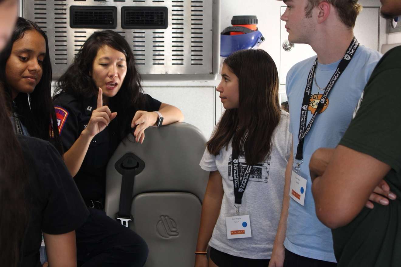 Selena teaching students inside an ambulance